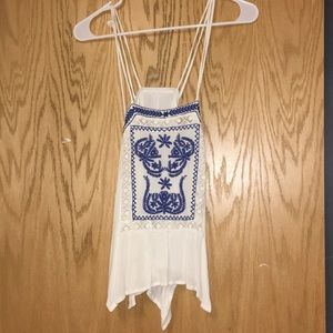 A white tank with blue design